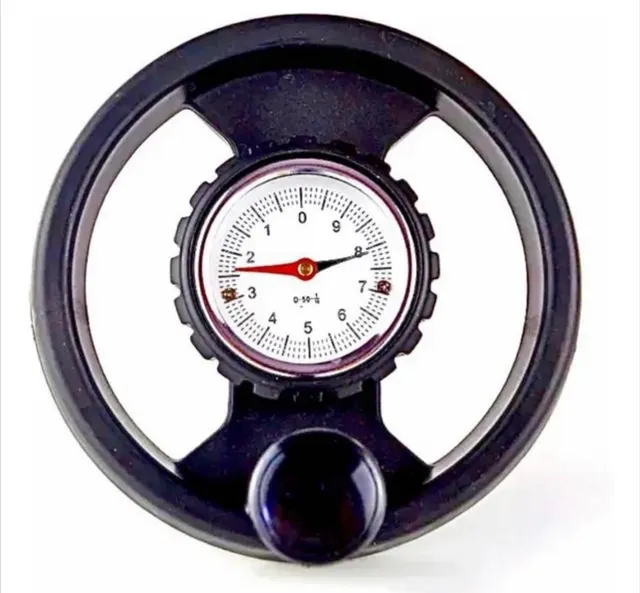 Volante com relógio indicador de posição gravitacional. 